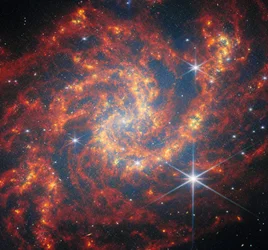 Webb besöker en stjärnbildande spiral
