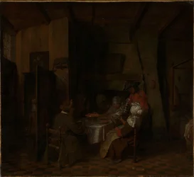 En familjemåltid i en bondstuga
