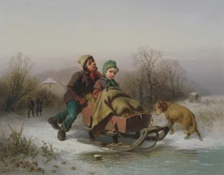 En pojke som knuffar en ung flicka i en släde