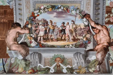 Acete, som hålls fången av två soldater, berättar om Bacchus gärningar för Pentheus och hans följe av krigare