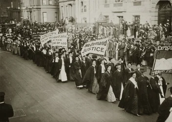 Women in academic dress marching in a suffrage parade in New York City, 1910 
