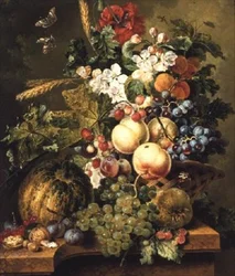 Frukt och blommor på en marmoravsats