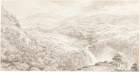 En bergsdal med ett vattenfall