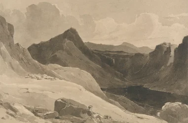 Ett bergslandskap med en herde