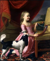 Ung dam med en fågel och en hund