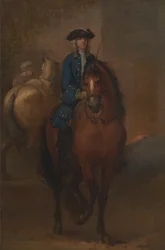 En ung gentleman som rider på en skolad häst