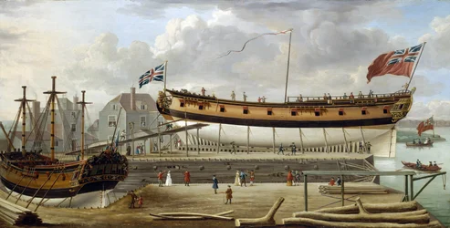 Ett fartyg av sjätte klass (sixth rate), ett brittiskt örlogsfartyg från Royal Navy, i torrdocka, varvet är troligen det i Rotherhite, på Themsens södra strand (England)