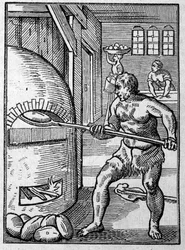 En bagare som bakar bröd i en ugn. Gravyr av Jost Amman (1539-1591) 1500-talet.