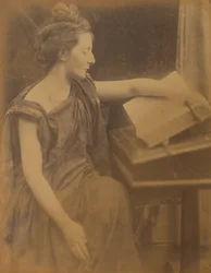 [Kvinna i kläder läser en bok], 1870.