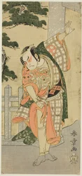 Skådespelaren Otani Hiroji III i en scenpose (Mie) framför en Shrine Gateway