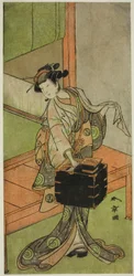 Skådespelaren Yamashita Kinsaku II som Miyagino förklädd till frisör i pjäsen Kosode-gura no Tekubari, framförd på Morita-teatern under andra månaden, 1772 (?)