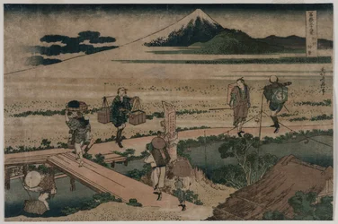 Utsikt över berget Fuji och resenärer vid en bro