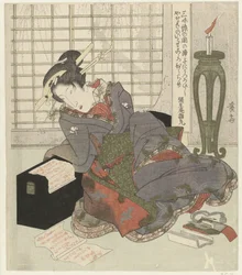 En geisha lutar sig mot sin shamisens låda