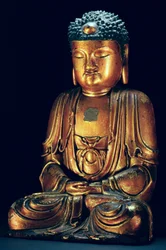 En figur av den sittande Buddha (guldlack)