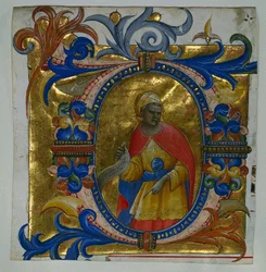 Initial D[eus in loco] med en profet utskuren från en gradual, 1409-10.