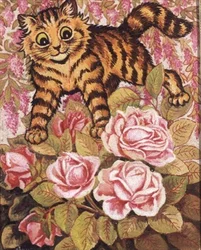 En kattunge som gömmer sig i en rosenbuske