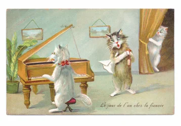 Edwardianskt vykort med en katt som spelar piano och en annan som sjunger, medan en tredje tittar fram, cirka 1910