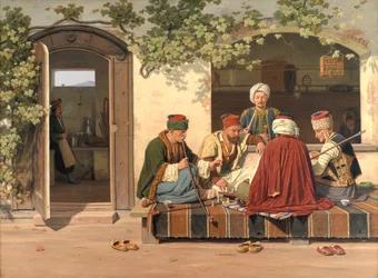 Ett sällskap med schackspelare utanför ett turkiskt kafé och frisersalong