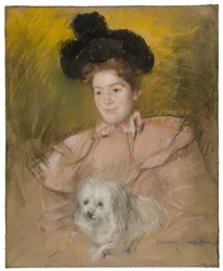 Kvinna i hallondräkt som håller en hund, ca. 1901.