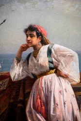 Ung orientalisk flicka på en terrass i Alger