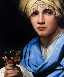 Pojke med turban håller i en blombukett