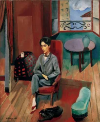 Jean Cocteau sitter i sin ateljé