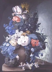 Grupp av blommor i en burk och fågelbo
