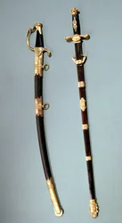 Jubileumssvärd som gavs av Napoleon Bonaparte för att ha hjälpt honom med hans framgångsrika statskupp vid Saint Cloud den 18 brumaire en 8 (9 november 1799) och ett tveeggat svärd av en general-befäl (jag)