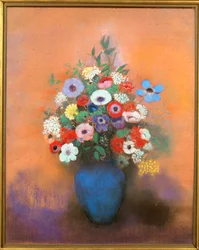 Anemoner och syrener i en blå vas