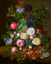 En korg med rosor och andra blommor