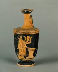 Kvinna vid ett altare. Liten, rödfigurerad lekythos...