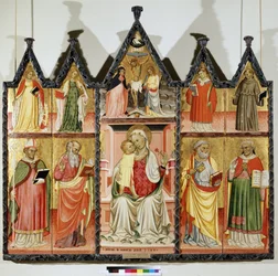 Polyptyk av jungfrun och barnet med heliga. Överst till vänster: Sankta Katarina av Alexandria och Sankta Maria Magdalena. I mitten runt Kristus på korset med inskriptionen ""INRI"" (I.N.R.I.). Jungfru Maria och Sankt Johannes. Överst till höger: S
