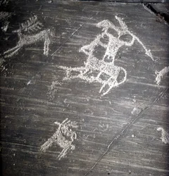Camunni civilisation, förhistoria, hällkonst: gravsten, som representerar jägare och rådjur. Rocher de Naquane, i Valcamonica (Val Camonica)