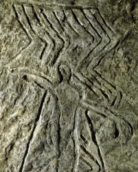 Förhistoria, hällkonst: hällristning (graffiti på sten) av en representation av en mänsklig figur. neolitik, stenålder. (Azerbajdzjan) Bronsåldern. Baku, Azerbajdzjans statliga religionshistoriska museum