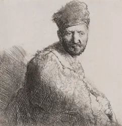 Skäggig man i pälsad orientalisk mössa och mantel