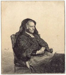 En äldre kvinna (Rembrandts mor, sittande vid ett bord)