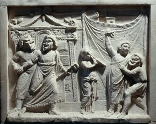 Relief av teaterscen från komedin 
