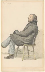 Man sittande i en Hitchcock-stol