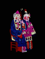 Par i traditionella kläder. Målad pappersklippning eller "Jian Zhi", kinesisk folkkonst, Pekin.
