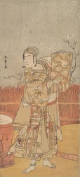 Skådespelaren Sawamura Sojuro III håller upp ett stycke brokad, sent 1700-tal.