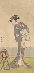 Den första Nakamura Tomijuro som en Oiran som står i ett rum, 1771.