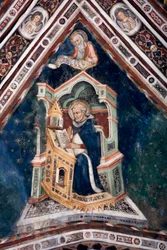 Vy över detaljerna i en fresk som dekorerar ett av övre kyrkans valv som representerar de fyra läkarna i den romerska kyrkan: Sankt Augustinus av Hippo och evangelisten Sankt Johannes. Klostret Saint Benedetto (Sacro Speco), Subiaco (Rom), Italien