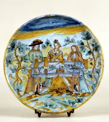 Representation av en utomhusbankett på en keramisk tallrik av Talavera de la reina (Spanien). Början av 1500-talet. Milano, Museo del Castello.