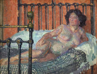 Naken på en säng, ca 1910