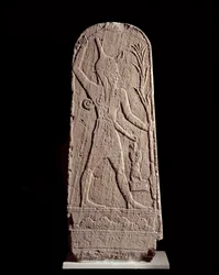 Orientalisk konst: stele av guden Baal i blixten. (Krigargud som skyddar kungen) Skulptur från 1400-talet f.Kr., Syrien. Paris, Musée du Louvre