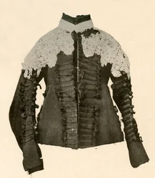 Dublett av svart tyg kantad med sidenfläta och virkade knappar, 1600-talet, 1937.