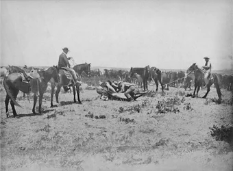 Inspecting a Brand on the Prairies, c1897.