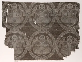 Lampasfragment med sittande prins som håller falkar i kufiska medaljonger, 1654-1955.