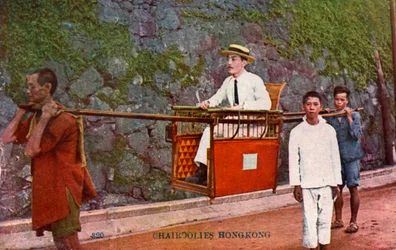 Man bärs på en Sedan-stol, Hongkong, 1900-talet