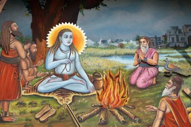 Målning som föreställer en helig man (sitter på en tigers hud som Shiva) omgiven av anhängare Haridwar Indien